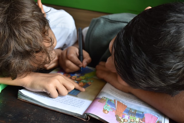 children reading during a class reading program