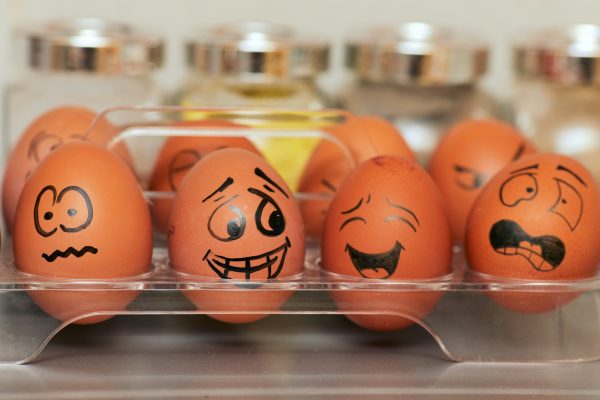 Eggs with different emotional faces drawn on them