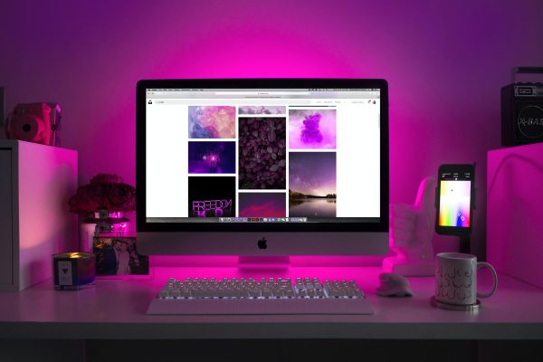 Computer with a purple background.