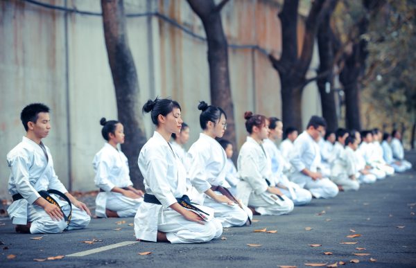 Karate students quietly sitting